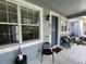 Inviting front porch featuring comfortable seating, creating a welcoming entrance to the home at 8417 Leeland Archer Blvd, Orlando, FL 32836