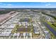 Neighborhood aerial view featuring well-maintained homes, serene ponds, and beautiful landscaping at 867 Bama Breeze Dr, Daytona Beach, FL 32124