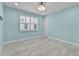 Inviting bedroom featuring light wood floors, recessed lights and a large window offering natural light at 867 Bama Breeze Dr, Daytona Beach, FL 32124