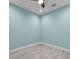 Cozy bedroom with ceiling fan, light wood floors and fresh paint at 867 Bama Breeze Dr, Daytona Beach, FL 32124