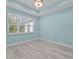 Bedroom with light wood floors, plantation shutters, and recessed lighting providing ample natural light at 867 Bama Breeze Dr, Daytona Beach, FL 32124