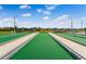 Well-maintained bocce ball courts surrounded by manicured lawns and landscaping at 867 Bama Breeze Dr, Daytona Beach, FL 32124
