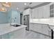 A close up of an island with an undermount sink, stainless appliances, and granite counters at 867 Bama Breeze Dr, Daytona Beach, FL 32124