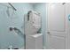 Functional laundry area with stacked washer and dryer at 867 Bama Breeze Dr, Daytona Beach, FL 32124