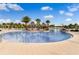 Lounge pool with sunbeds under tiki umbrellas, offering shaded relaxation at 867 Bama Breeze Dr, Daytona Beach, FL 32124