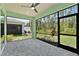 Screened in lanai with brick flooring and views of the backyard at 867 Bama Breeze Dr, Daytona Beach, FL 32124