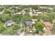 Overhead picture of the brick two-story home in its neighborhood with mature trees at 900 S Palmetto Ave, Sanford, FL 32771
