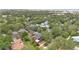 Aerial shot of a residential area with beautiful homes surrounded by mature trees, showcasing a vibrant community at 900 S Palmetto Ave, Sanford, FL 32771