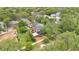 Stunning aerial view of a home with a brick patio and lush landscaping, set among mature trees in a desirable location at 900 S Palmetto Ave, Sanford, FL 32771