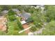 Beautiful aerial view of a brick home with well-manicured landscaping and mature trees creating a private oasis at 900 S Palmetto Ave, Sanford, FL 32771