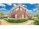 Exterior side view showcasing the home's architectural details and manicured landscaping at 900 S Palmetto Ave, Sanford, FL 32771