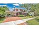 Stunning home with a brick driveway, a covered parking area, and inviting curb appeal at 900 S Palmetto Ave, Sanford, FL 32771