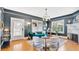 Inviting living room with a teal sofa, stylish decor, a cozy fireplace, and lots of natural light at 900 S Palmetto Ave, Sanford, FL 32771