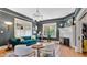 Sophisticated living room with stylish furniture, fireplace, and natural light at 900 S Palmetto Ave, Sanford, FL 32771