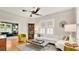 Comfortable living room with stylish furniture, plenty of natural light, and hardwood floors throughout at 900 S Palmetto Ave, Sanford, FL 32771