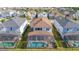 Aerial view of backyard showing a screened-in pool and patio area, surrounded by a fenced yard at 9038 Sunshine Ridge Loop, Kissimmee, FL 34747