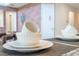 Close-up of dining setting with classic white dishware, complementary grey placemats, and granite countertop at 9038 Sunshine Ridge Loop, Kissimmee, FL 34747