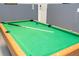 Close-up of a pool table with ball and cue at 9038 Sunshine Ridge Loop, Kissimmee, FL 34747