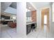 Hallway with open floor plan, showing the kitchen and living room, and a view of the bathroom at 9038 Sunshine Ridge Loop, Kissimmee, FL 34747
