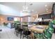 Open-concept living space includes kitchen, dining and living room areas, great for entertaining guests and Gathering at 9038 Sunshine Ridge Loop, Kissimmee, FL 34747