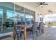 Covered patio space offering comfortable seating, ceiling fans and lovely views of the surroundings at 9038 Sunshine Ridge Loop, Kissimmee, FL 34747
