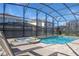 Relaxing screened-in pool and hot tub area with comfortable lounge chairs and well-kept surroundings, ideal for outdoor enjoyment at 9038 Sunshine Ridge Loop, Kissimmee, FL 34747