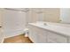 Bathroom featuring tiled shower and tub combination, updated vanity, and sink at 922 Hatteras Ave, Minneola, FL 34715