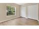 Bedroom featuring large window view and ample closet space at 922 Hatteras Ave, Minneola, FL 34715