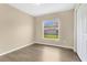 Bright bedroom featuring a window view and closet at 922 Hatteras Ave, Minneola, FL 34715