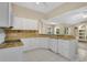Well-equipped kitchen with a breakfast bar and views into the living areas at 922 Hatteras Ave, Minneola, FL 34715