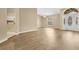 Spacious living room featuring hard surface flooring and a view into the modern kitchen at 922 Hatteras Ave, Minneola, FL 34715