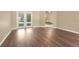 Bright living area with new floors and French doors leading to the backyard at 922 Hatteras Ave, Minneola, FL 34715