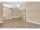 Bright and open living room featuring new floors, high ceilings, and neutral paint colors at 922 Hatteras Ave, Minneola, FL 34715