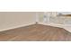 Inviting living space with views of the kitchen area and modern hard surface flooring at 922 Hatteras Ave, Minneola, FL 34715