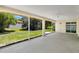 Spacious screened patio with ample room for outdoor seating and views of the green backyard at 922 Hatteras Ave, Minneola, FL 34715
