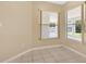 Bright and airy sunroom with tiled flooring and expansive views of the backyard at 922 Hatteras Ave, Minneola, FL 34715