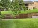 Scenic backyard view overlooking lush green space and peaceful canal at 9926 Turf Way # 8, Orlando, FL 32837