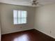 Bright bedroom featuring gleaming hardwood floors and ceiling fan at 9926 Turf Way # 8, Orlando, FL 32837
