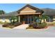 A well-maintained clubhouse featuring manicured landscaping and inviting entry at 9926 Turf Way # 8, Orlando, FL 32837
