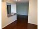 Spacious living room shows open floor plan with hardwood floors at 9926 Turf Way # 8, Orlando, FL 32837