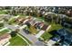 Aerial view of a well-maintained neighborhood with manicured lawns and mature trees at 997 La Mirada Ct, Kissimmee, FL 34744