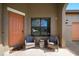 Inviting front porch with seating, perfect for relaxing and enjoying the outdoors at 997 La Mirada Ct, Kissimmee, FL 34744