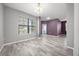 Living room with new floors and paint has access to other parts of the house at 997 La Mirada Ct, Kissimmee, FL 34744