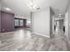 Spacious living room with new floors and paint offers an inviting space for relaxation and entertainment at 997 La Mirada Ct, Kissimmee, FL 34744