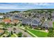 Scenic aerial view showcasing a charming neighborhood with a two-story home featuring a landscaped yard and inviting front porch at 1071 Kershaw Dr, Winter Garden, FL 34787