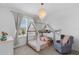 Bedroom includes a canopy bed, modern chandelier and ample lighting at 1071 Kershaw Dr, Winter Garden, FL 34787