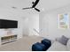 Upstairs bonus room with plush carpeting, ceiling fan, and comfortable seating area at 1071 Kershaw Dr, Winter Garden, FL 34787