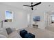 Bright bonus room featuring neutral colors, a comfortable sofa and a mounted TV at 1071 Kershaw Dr, Winter Garden, FL 34787