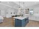 Open kitchen with an island, pendant lights, and a view into the dining area at 1071 Kershaw Dr, Winter Garden, FL 34787