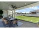 Screened patio showcases a grill, outdoor seating and views of the landscaped backyard, perfect for entertainment at 1071 Kershaw Dr, Winter Garden, FL 34787